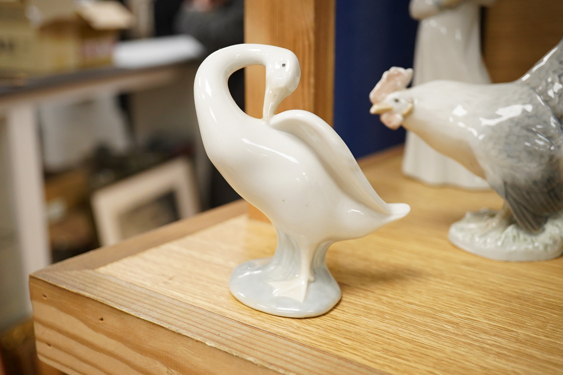 A group of Copenhagen, Nao and Lladro figures to include birds, together with a Royal Copenhagen vase, largest 21cm high